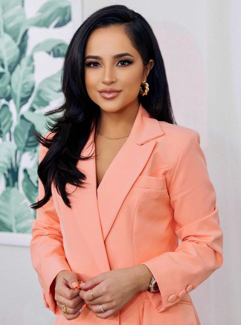 Becky G wearing the peach blazer from Trouser9, featured as a celebrity style highlight on the homepage