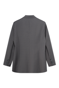 Back view of the grey pinstripe blazer featuring a double-breasted style and elegant pinstripe pattern