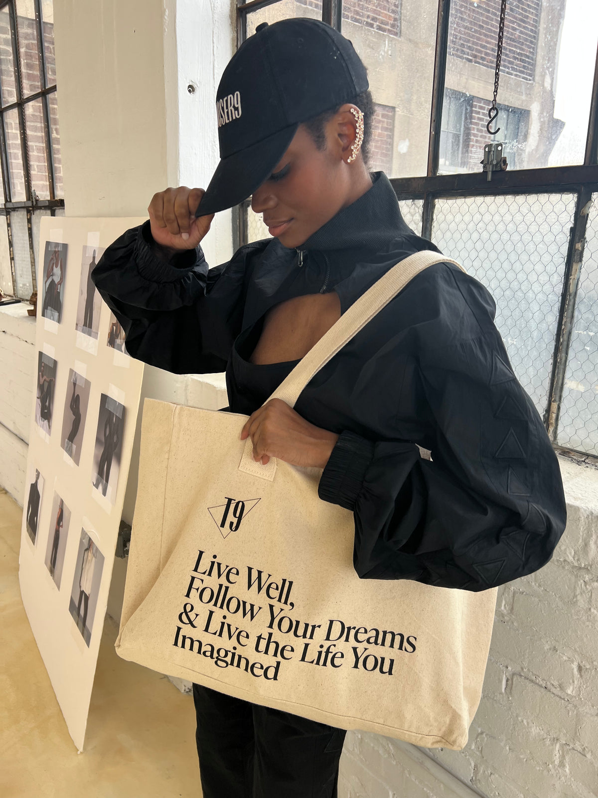 Front view of the large canvas tote featuring 'Live Well' messaging and the TROUSER9 brand logo